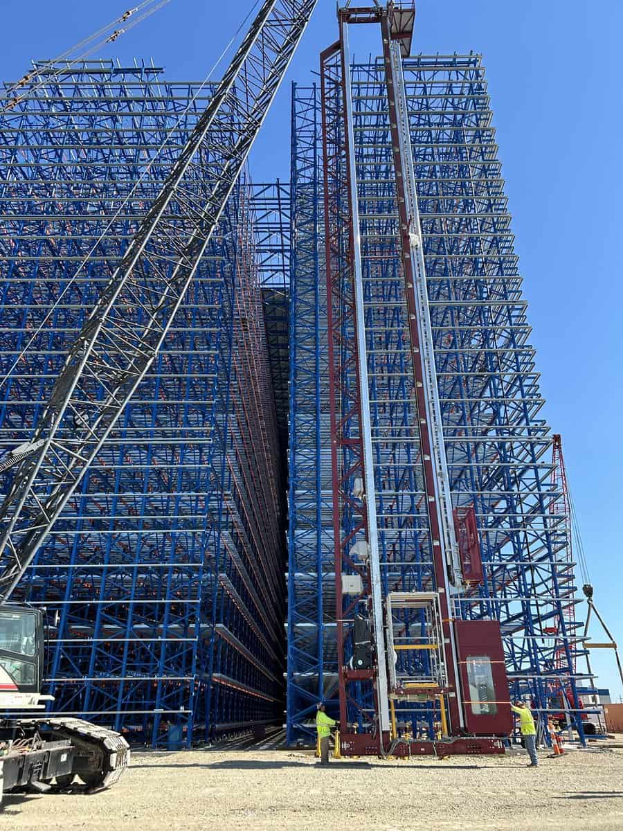 Construction site with project manager reviewing plans
